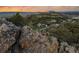 Beautiful house overlooking the lush green landscape with mature trees at 6402 Wauconda Dr, Larkspur, CO 80118