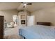 Spacious main bedroom with a fireplace, sitting area, and en-suite bathroom at 6402 Wauconda Dr, Larkspur, CO 80118