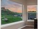 Room with expansive windows providing stunning views of the mountains, neighborhood, and landscaped yard at 6402 Wauconda Dr, Larkspur, CO 80118