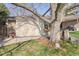 Charming backyard featuring a detached garage, stone landscaping, and mature shade trees, great for outdoor gatherings at 2 Larkdale Dr, Littleton, CO 80123