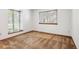Sun-filled bedroom with two windows for natural light and carpet flooring throughout at 2 Larkdale Dr, Littleton, CO 80123