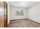 Bedroom features carpet flooring, a window for natural light, and a door to the closet at 2 Larkdale Dr, Littleton, CO 80123