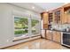 Inviting breakfast nook with backyard view, light-filled space, and custom wood cabinetry at 2 Larkdale Dr, Littleton, CO 80123