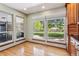 Charming breakfast nook with large windows offering views of the landscaped backyard at 2 Larkdale Dr, Littleton, CO 80123