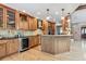 Spacious kitchen featuring granite counters, a wine cooler, and ample cabinet space at 2 Larkdale Dr, Littleton, CO 80123
