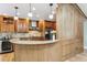 Kitchen view with granite countertop, wine cooler and stainless steel hood at 2 Larkdale Dr, Littleton, CO 80123
