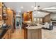 Well-lit kitchen with modern appliances and view into the dining and living rooms at 2 Larkdale Dr, Littleton, CO 80123