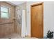 Clean shower featuring tile walls, window, shower curtain and multiple shower heads at 2 Larkdale Dr, Littleton, CO 80123