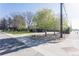 A bright street view showcasing the home's location, mature trees, and well-maintained landscaping at 2 Larkdale Dr, Littleton, CO 80123