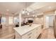 Finished basement with modern lighting, neutral walls, wood floors, and lots of open space at 5983 Fulton St, Denver, CO 80238