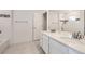 Bathroom with dual sinks, vanity and a glass enclosed shower, and decor at 5983 Fulton St, Denver, CO 80238