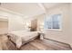 Comfortable bedroom with a cozy bed, soft lighting, and a large window, creating a relaxing retreat at 5983 Fulton St, Denver, CO 80238