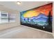 Bedroom with large mural and a window providing natural light and neutral carpeting at 5983 Fulton St, Denver, CO 80238