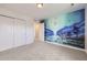 Bright bedroom with a mural featuring a moon, waterfall, and a crane at 5983 Fulton St, Denver, CO 80238