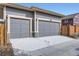 Attached two car garage with concrete driveway at 5983 Fulton St, Denver, CO 80238