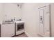Well-equipped laundry room featuring modern washer and dryer units at 5983 Fulton St, Denver, CO 80238