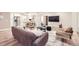 Inviting open floorplan featuring living room and kitchen with a modern design at 5983 Fulton St, Denver, CO 80238