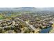 An aerial view showcasing a well-planned community with houses, greenery, and mountain views at 6378 Noble Ct, Arvada, CO 80403