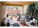 Outdoor patio with comfortable seating and a small table for relaxing and entertaining at 6378 Noble Ct, Arvada, CO 80403