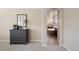 A view from a bedroom into an ensuite bathroom with large soaking tub at 6378 Noble Ct, Arvada, CO 80403