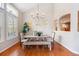 Open dining room with hardwood floors and modern lighting, with lots of light from surrounding windows at 6378 Noble Ct, Arvada, CO 80403