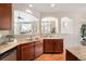 Well-appointed kitchen featuring granite countertops, stainless steel appliances, and hardwood flooring at 6378 Noble Ct, Arvada, CO 80403