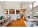 Spacious living room shows open layout with fireplace and lots of natural light from surrounding windows at 6378 Noble Ct, Arvada, CO 80403