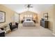 Spacious main bedroom with vaulted ceiling, plush carpeting and a seating area at 6378 Noble Ct, Arvada, CO 80403