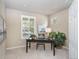 Bright home office featuring neutral walls, carpet, and a large window for natural light at 6378 Noble Ct, Arvada, CO 80403