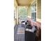 Cozy porch with comfortable seating, offering a relaxing outdoor space at 6378 Noble Ct, Arvada, CO 80403