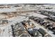 Aerial view of house and neighborhood in winter at 6891 Longpark Dr, Parker, CO 80138