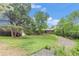 Beautifully landscaped backyard with mature trees and well-maintained lawn at 2743 S Reading Ct, Denver, CO 80231