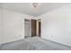 Bedroom featuring plush carpeting, a closet, and easy access to other rooms at 2743 S Reading Ct, Denver, CO 80231
