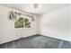 Bedroom with light blue carpeting and decorative curtains providing natural light at 2743 S Reading Ct, Denver, CO 80231