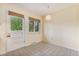 Bright dining area featuring tile flooring, ample natural light, and white door at 2743 S Reading Ct, Denver, CO 80231