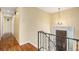 Foyer with hardwood floors, chandelier, and staircase at 2743 S Reading Ct, Denver, CO 80231