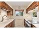 Kitchen featuring white countertops, updated stainless appliances, and cabinetry at 2743 S Reading Ct, Denver, CO 80231