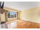 Bright and spacious living room featuring large windows and hardwood flooring at 2743 S Reading Ct, Denver, CO 80231