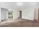 Large main bedroom featuring ensuite bathroom, mirrored closet doors, and large window at 2743 S Reading Ct, Denver, CO 80231