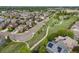 A nice neighborhood with sidewalks, a green park and a winding walkway at 41 Jordan Ln, Erie, CO 80516