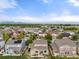 Neighborhood aerial view of rooftops and mountains in the distance at 41 Jordan Ln, Erie, CO 80516