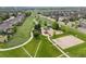 Aerial image of a neighborhood with a park, playground, and walking trails at 41 Jordan Ln, Erie, CO 80516