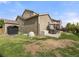 Spacious backyard featuring a patio, green lawn, and privacy fence at 41 Jordan Ln, Erie, CO 80516