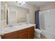 Full bathroom with double sinks and shower tub combo at 41 Jordan Ln, Erie, CO 80516
