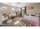 Bright bedroom with multiple windows, carpeted floor, and charming decor at 41 Jordan Ln, Erie, CO 80516