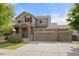 Charming two-story home with a three car garage, brick accents, and covered entry at 41 Jordan Ln, Erie, CO 80516
