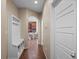 Hallway view with a bench, coat hooks, and hardwood floors at 41 Jordan Ln, Erie, CO 80516