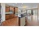 Modern kitchen with stainless steel appliances, dark cabinetry, and breakfast bar at 41 Jordan Ln, Erie, CO 80516