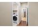 Convenient laundry room with a newer washer, dryer and shelving at 41 Jordan Ln, Erie, CO 80516