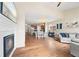 Open-concept living room with fireplace, hardwood floors, and plenty of natural light at 41 Jordan Ln, Erie, CO 80516